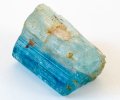 Aquamarine rough with vertical striations and iron straining