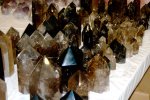 Polished smoky quartz crystals in display